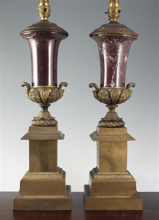A pair of gilt metal and rouge marble mounted table lamps, height to fittings 20.75in.